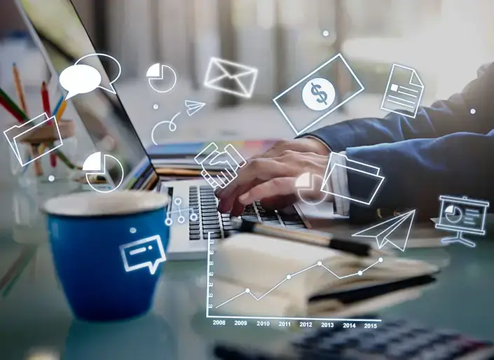 Person working on laptop with digital marketing icons – Spectrum Eclipse Glasses affiliate program.